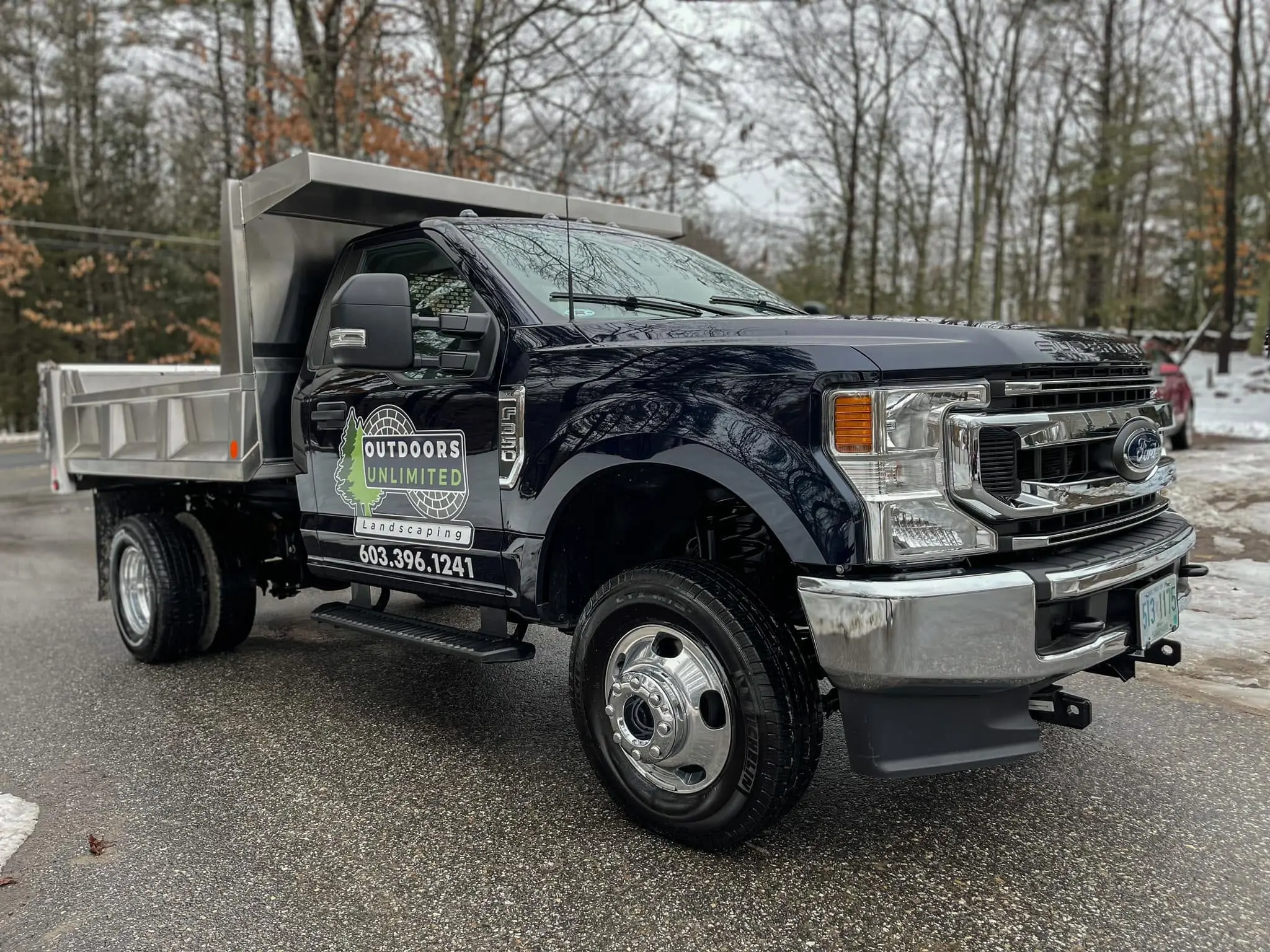 Black Outdoors Unlimited landscaping dump truck detailed by Midnight Detailing in New Hampshire